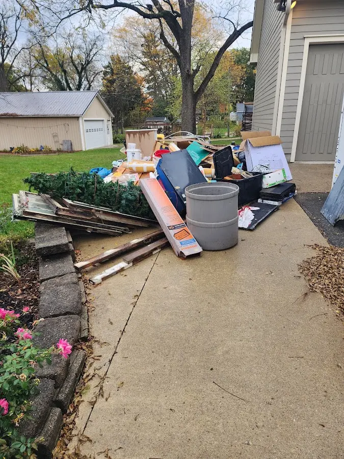 Dumpster being loaded with debris for 3 Yard Dumpster Rental in Pine Creek